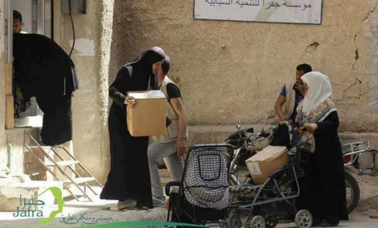 توزيع مساعدات إغاثية في اليرموك و خان الشيح